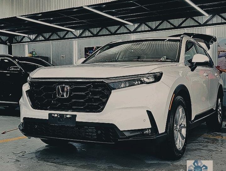 White Honda SUV at a workshop