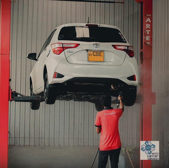 Toyota vehicle on a workshop lift