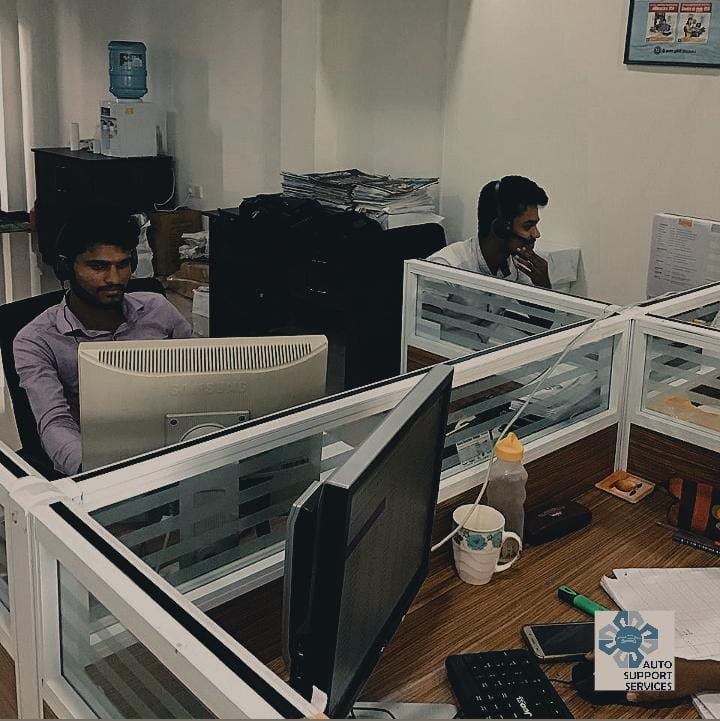 Staff working at an office support desk